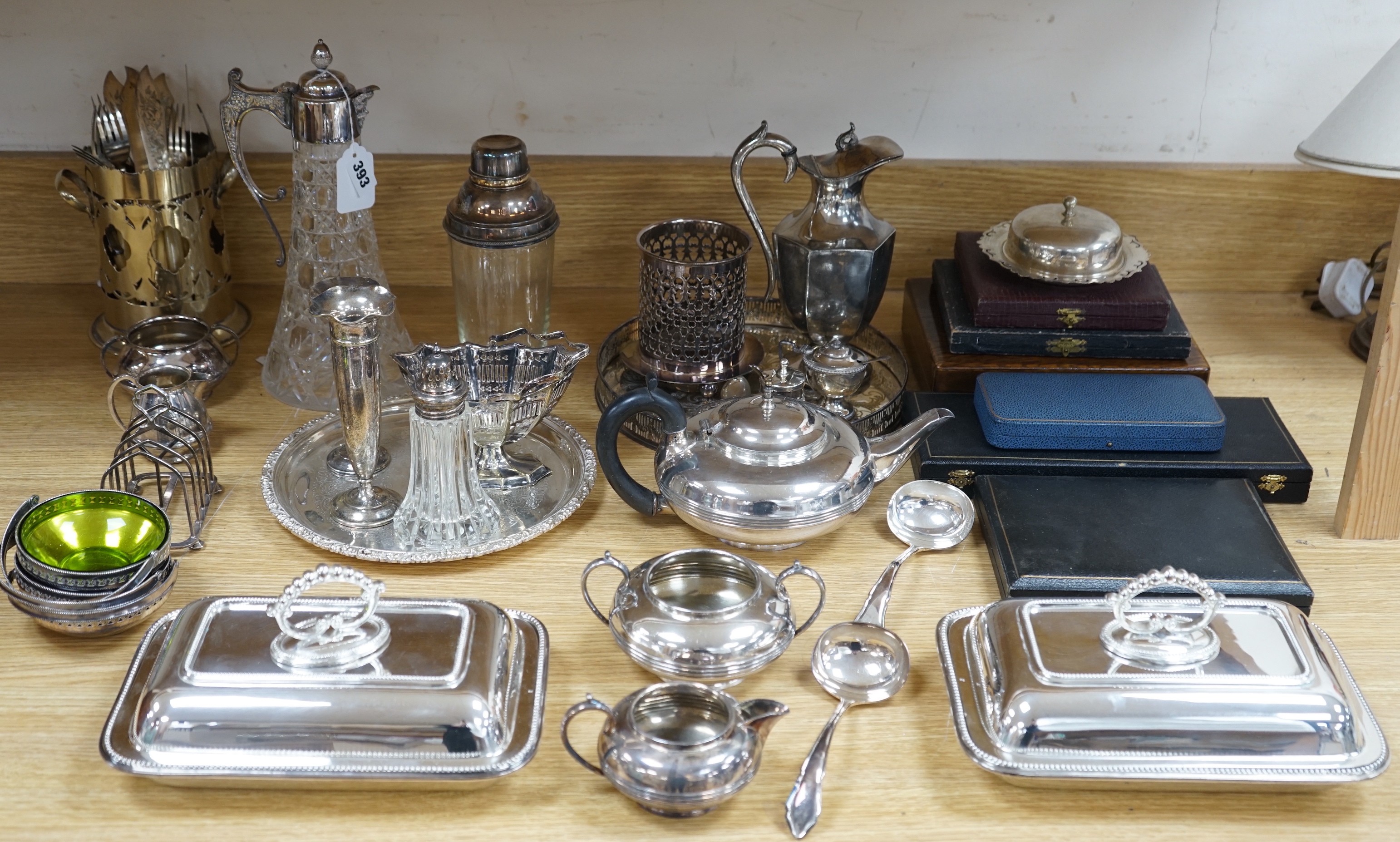 A quantity of silver plate including a cocktail shaker and a ewer